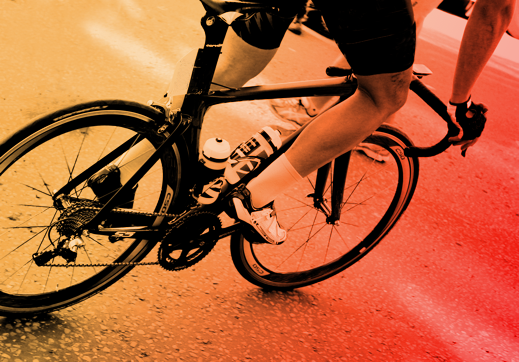 Close up of a cylists legs and bike in a turn